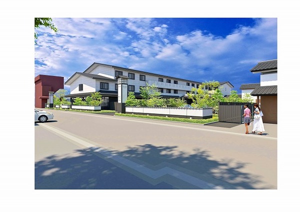 大きな建物前の通りを女性二人が歩いている様子