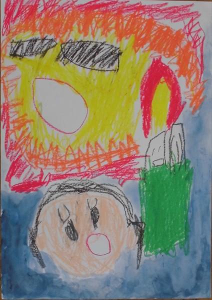 上の方に火が描かれていて、下に驚いた様子の女の子の絵が描かれているポスターの写真