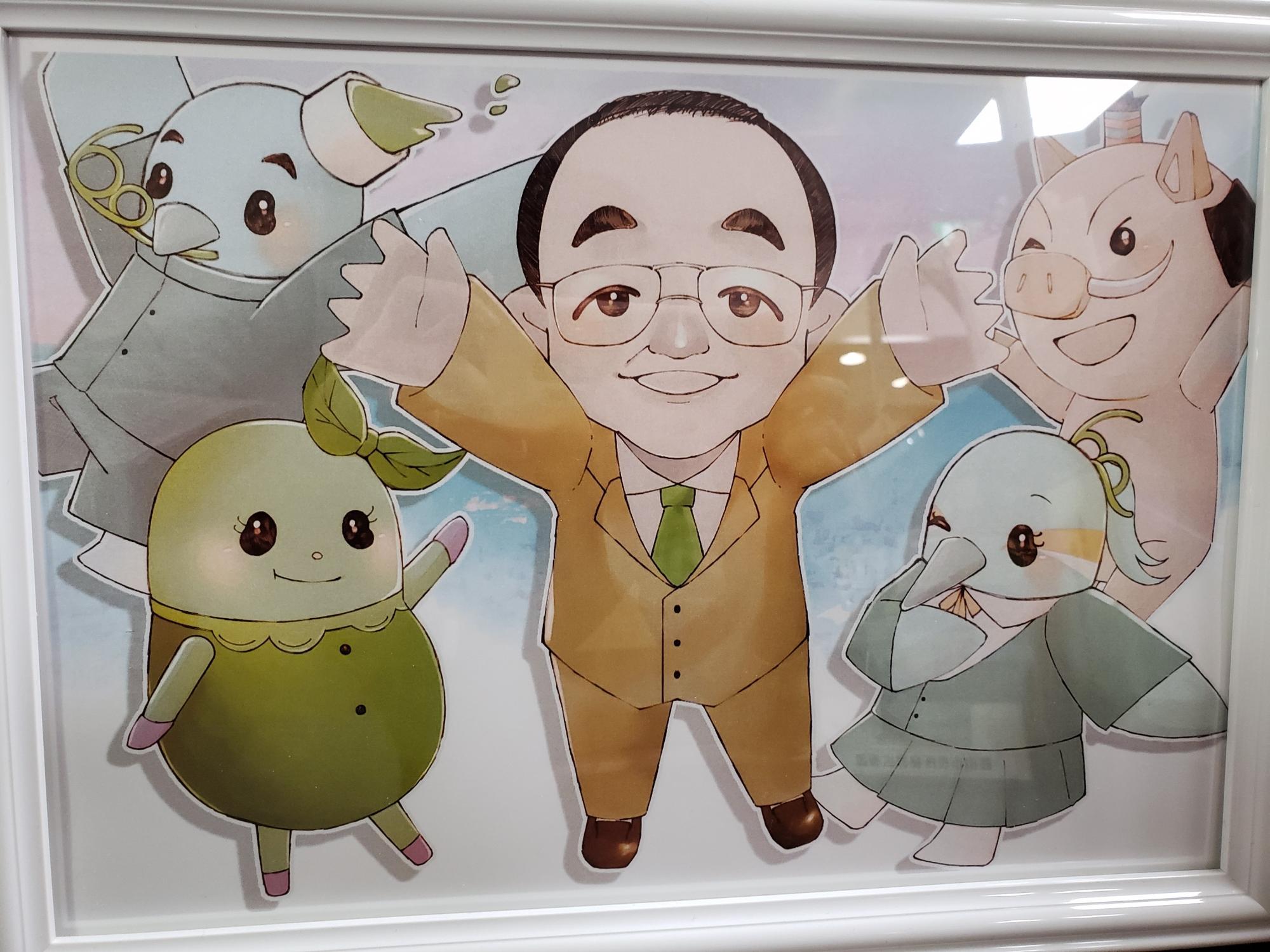 市長を真ん中に、そのまわりに、まるいのまめりん丹くん南ちゃんのイラストが描いてある